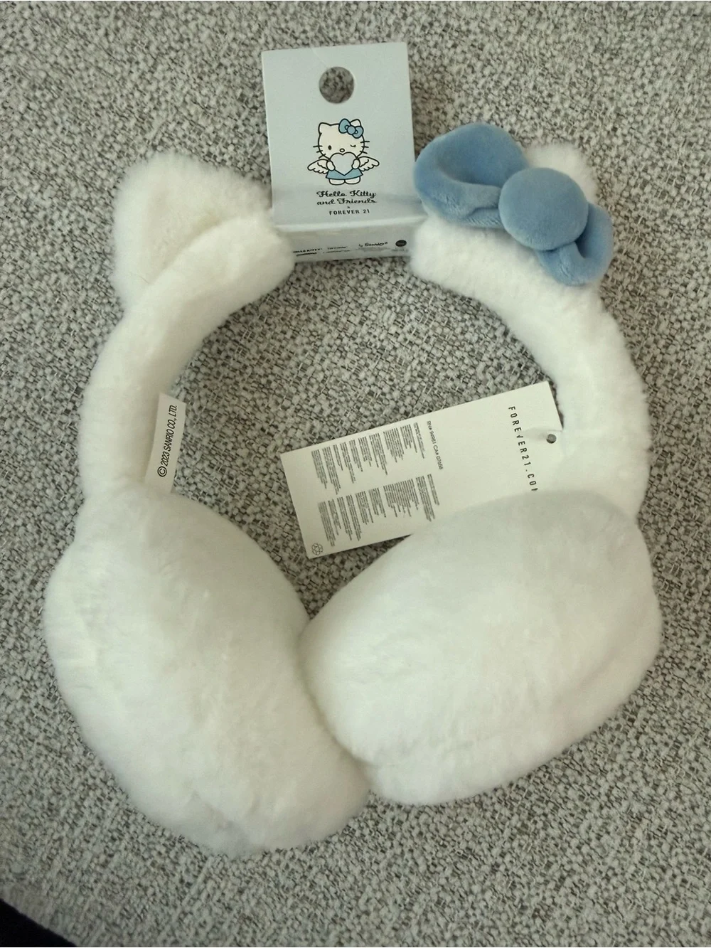Hello Kitty White Faux Fur Earmuffs with Light Blue Bow Accent